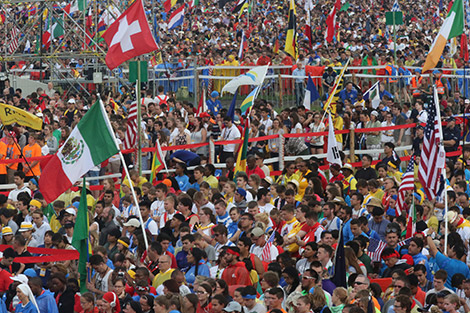 Pilgrims gather during the opening Mass for World Youth Day July 26 at Blonia Park in Krakow, Poland. (CNS photo/Bob Roller)