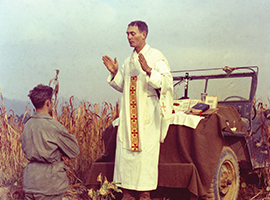 Father Emil Kapuan who served as a U.S. Army chaplain during the Korean War celebrates Mass in the field. Kapuan later died in a Korean P.O.W. camp and was awarded the Medal of Honor for his bravery there. U.S. Government photo.