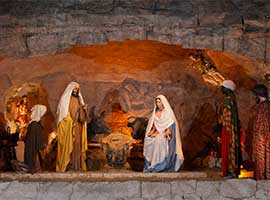 A Vatican nativity scene awaits the placement of the infant Christ figure on Christmas Eve. CNS photo/Paul Haring