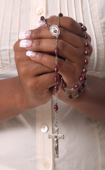 African American praying the rosary