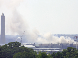 The smoldering Pentagon as seen from the roof of the U.S. Conference of Catholic Bishops on 9/11/01. CNS photo/Bob Roller.