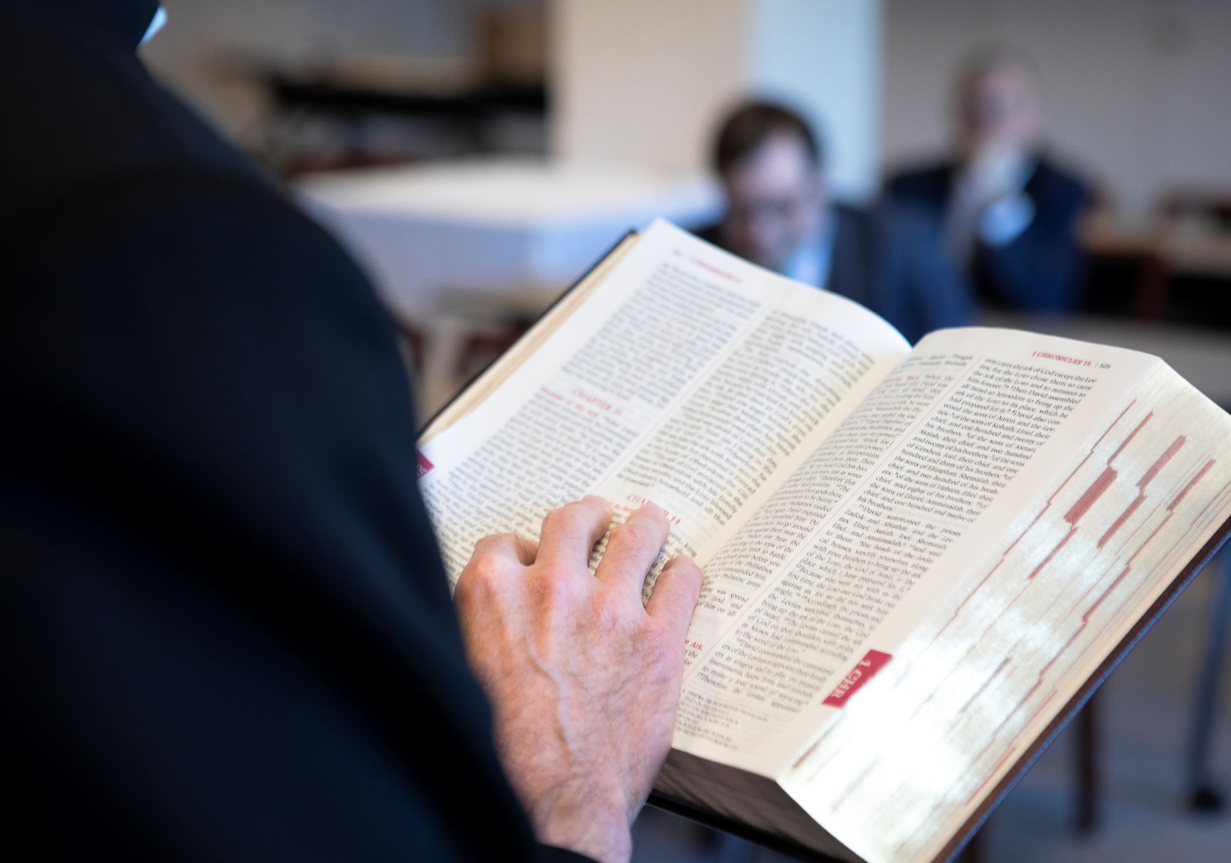 Reading a bible in a room