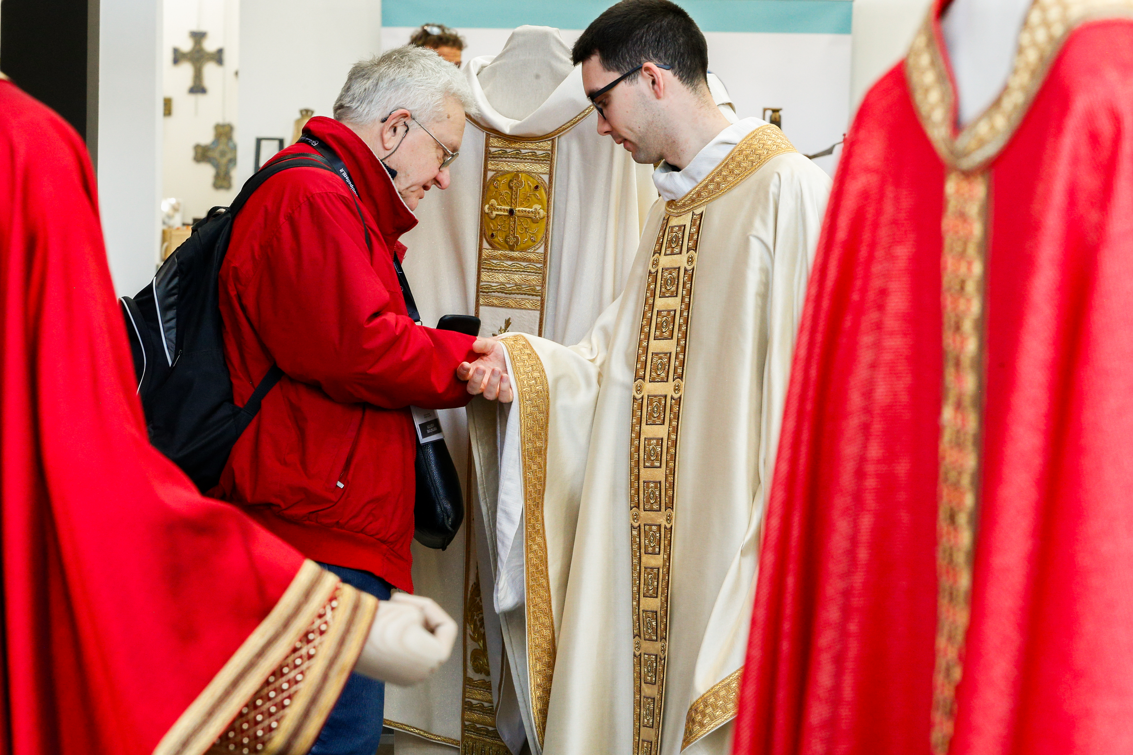 A priest shops for a chasuble.
