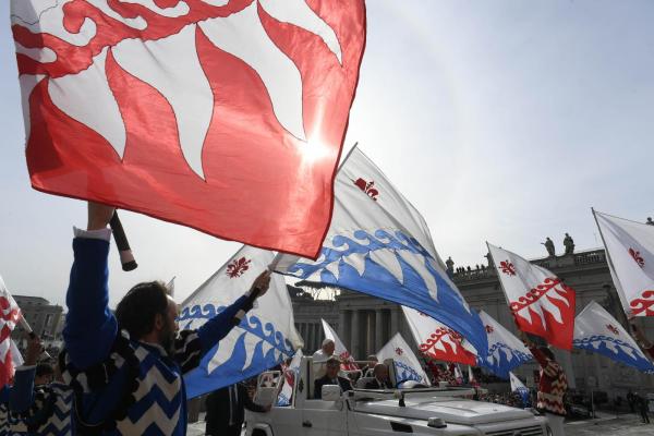 Flag twirlers greet Pope Francis