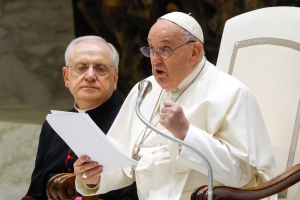 Pope Francis reads his catechesis during his general audience.