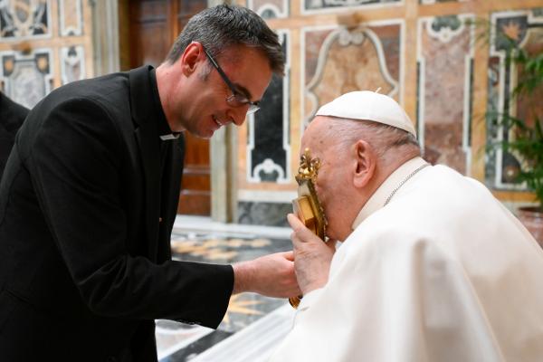 Pope Francis kisses relics