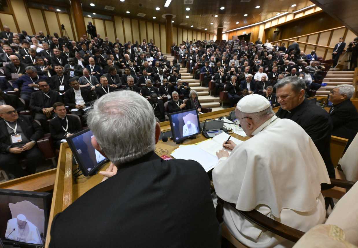 Pope Francis signs letter to priests