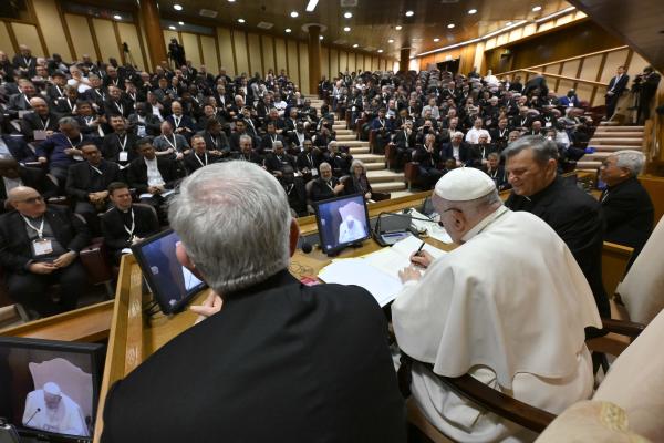 Pope Francis signs letter to priests